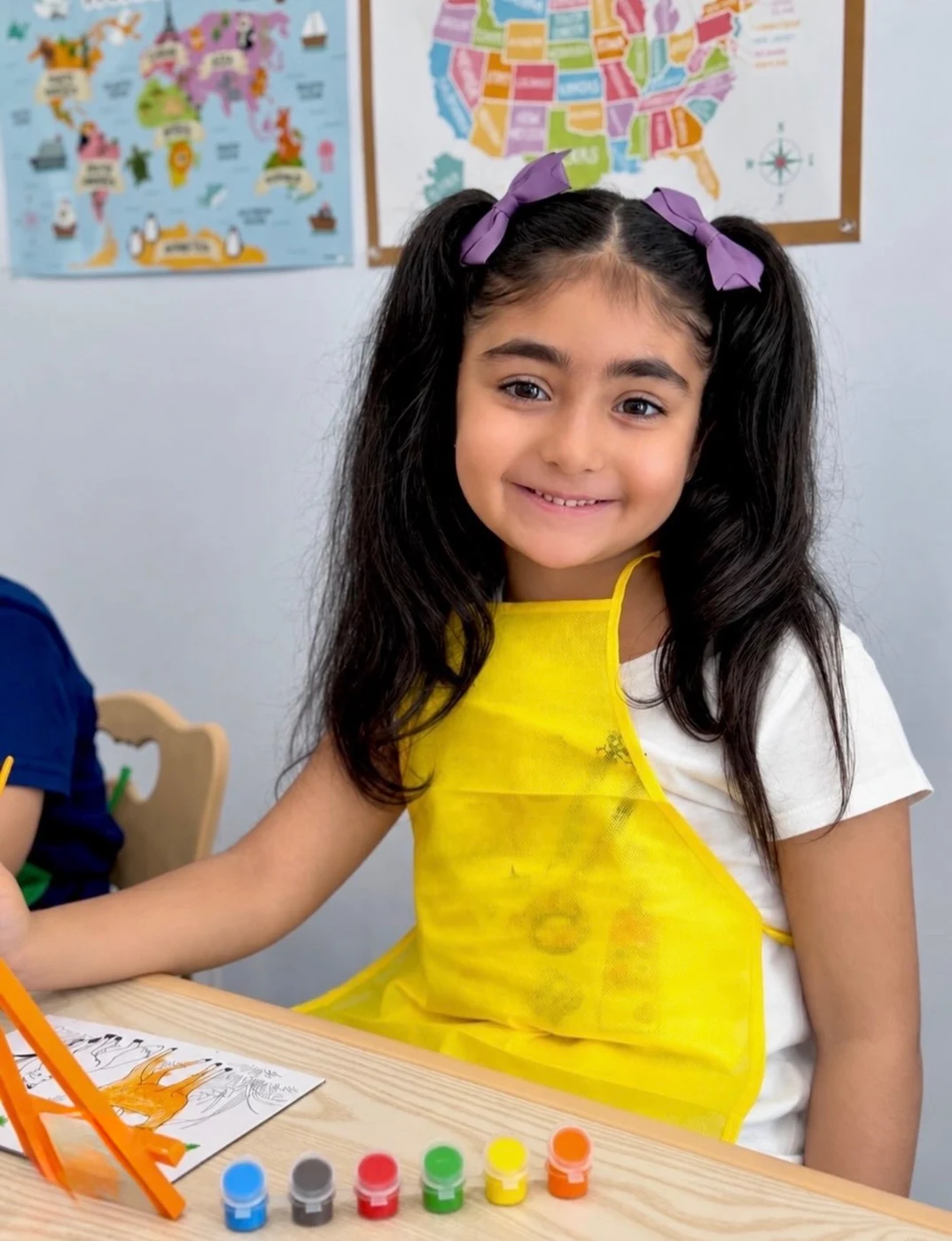 A child enjoying a creative painting project
